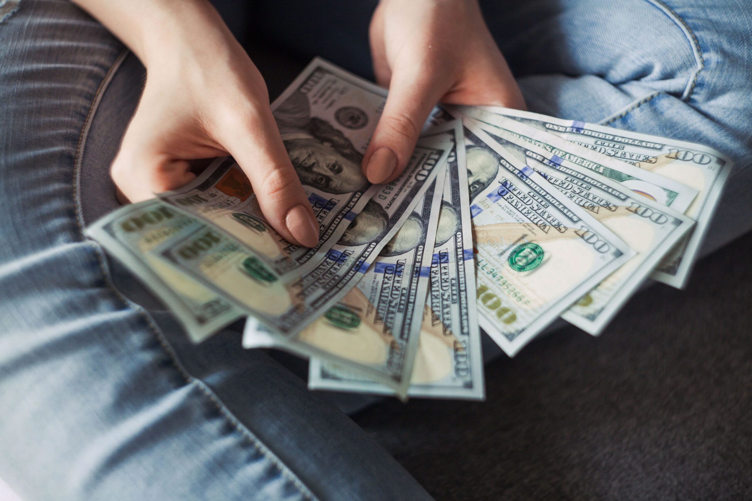Money Fanned Out in Persons Hands Money Fanned Out in Persons Hands